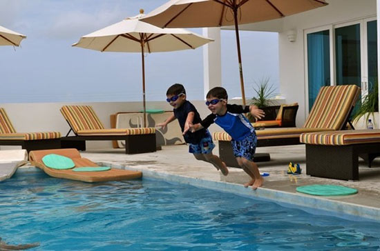 jumping into the pool at tequila sunrise villa