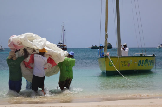 placing the sail on the anguilla racing boat de tree