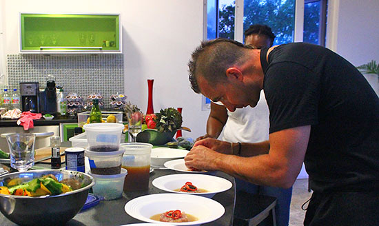 chef marc forgione putting the finishing touches on tartare